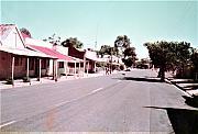 Geoffrey O’Shea crossing Commercial Road, Tarnagulla with his corgi C1982